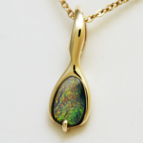 14k Yellow Gold Pendant with a SOLID BLACK OPAL Golden fire always. Very bright and rich colour